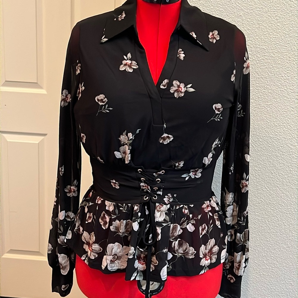 Really nice corset black floral blouse.  Fitted in chest.